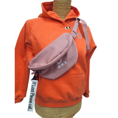 Orange hoodie and pale pink sling bag from sensory friendly clothing brand Diverse MMX